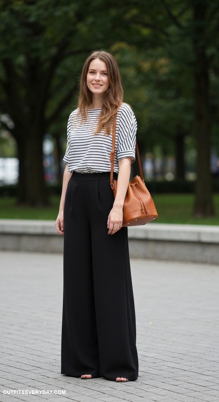 brown leather bag outfits Brown bucket bag with a striped shirt and black wide leg trousers